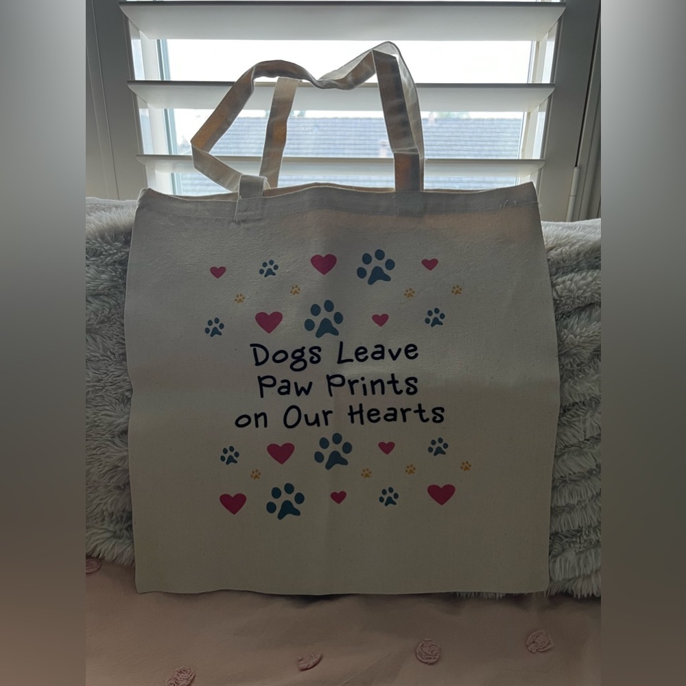 “dogs leave paw prints on our hearts” tote bag!